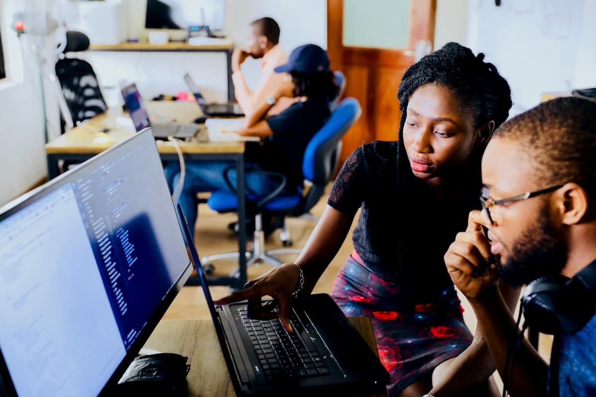 A coding education session — students from diverse backgrounds